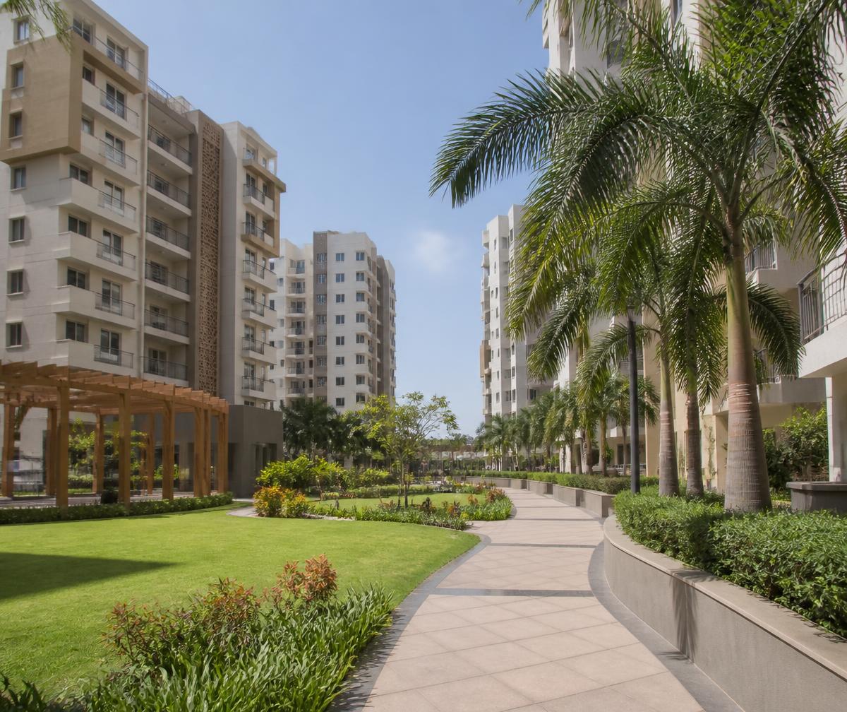 Landscaped garden and apartment towers of an Indian residential housing society